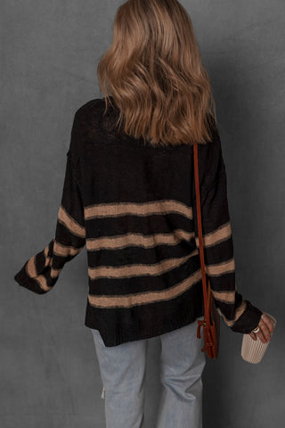 women modeling a black and tan stripe henley sweater