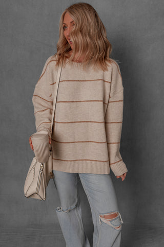 women modeling a chunky cream and brown stripe sweater